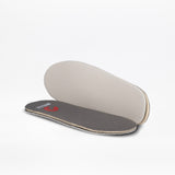 Two Dark Grey BILLY Classic D|R II High orthopedic insoles by BILLY Footwear—one shows a gray top with red logo, the other reveals the beige underside—perfect for kids' orthopedic or adaptive shoes.