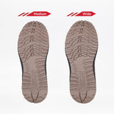 Two taupe Men's BILLY Inclusion Trail Boot soles from BILLY Footwear are displayed side by side on a white background, with the left labeled Medium and the right labeled Wide to show the difference in width.