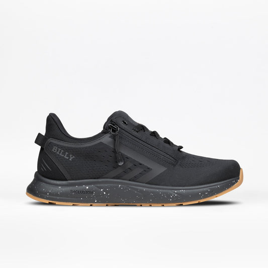 The Men's Black/Black/Gum BILLY Sport Inclusion DZ1 by BILLY Footwear is a black athletic sneaker for men featuring double zippers, a speckled black-and-white midsole, tan gum outsole, and BILLY branding on the heel, shown on a white background.